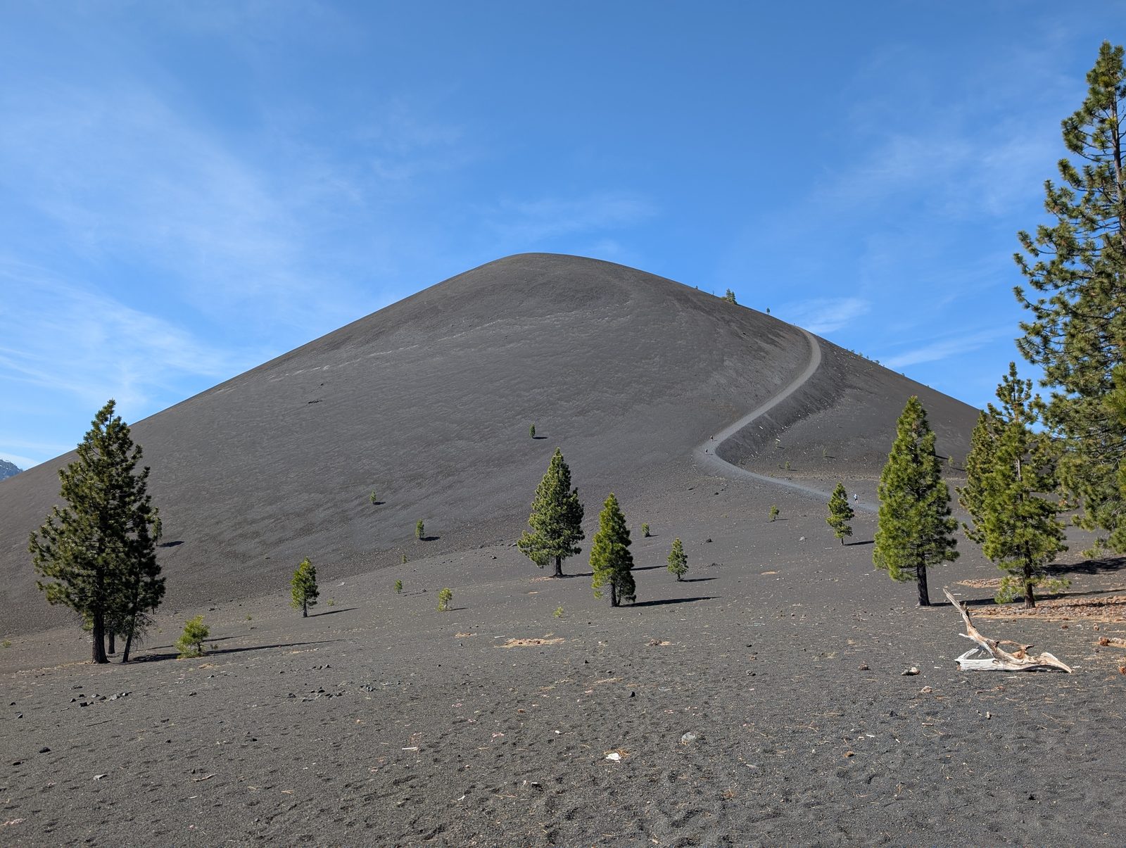 The switchback trail climbing the bare slope of Cinder Cone volcano