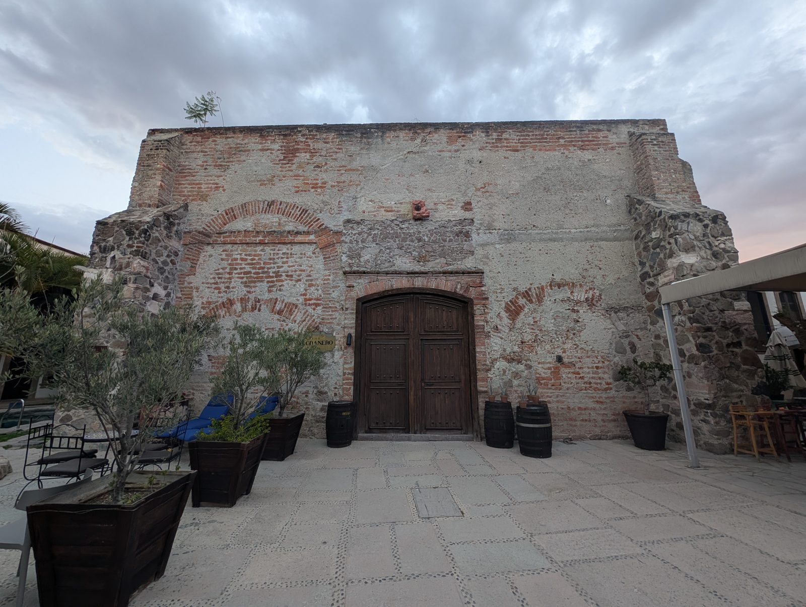 The old stone-and-brick facade of El Granero, a restored granary building at the hacienda